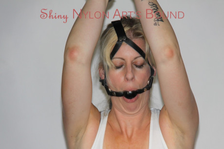 Pretty Pia tied and gagged overhead with chains, cuffs and a holster with a - #280049