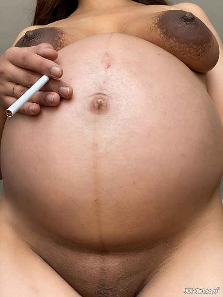 Pregnant smoker Leila teasing undressed with her bulging tummy & her dark nipples - Image 19 of 20  in Close Up category   featuring Leila 