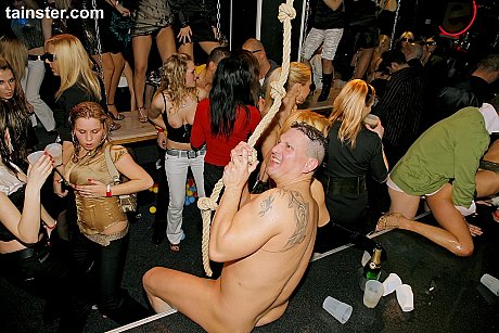 Fully clothed bitches blow and fuck male strippers inside a club