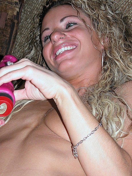 Slender curly-haired MILF Holly toys her tight love hole up close on the sofa - Image 19 of 20  in Dildo category   featuring Holly 