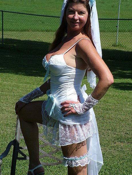Slutty mature bride reveals her juggs and fingers her clam on an outdoor chair - Image 5 of 20  in Outdoor category   featuring Dee Delmar 