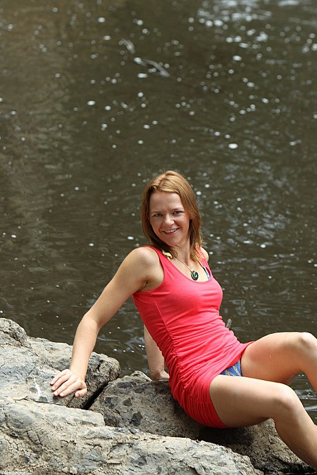 Adorable babe with nice small titties Billie rubs her hairy pussy outdoors