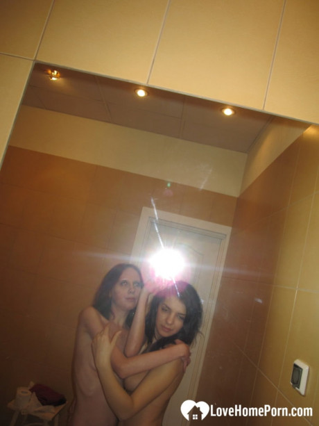 Amateur lesbians fondle each other's small melons while posing in the mirror - #904275