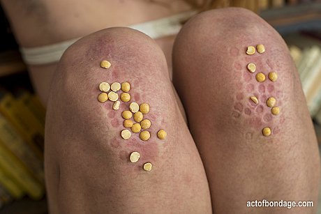 Natural red hair is forced to kneels on peas with bushy body exposed - Image 14 of 16  in Pussy category   featuring Lera 