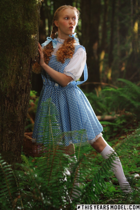 Lovely redhead young Dolly Little gets undressed in white socks while in a forest - #637886