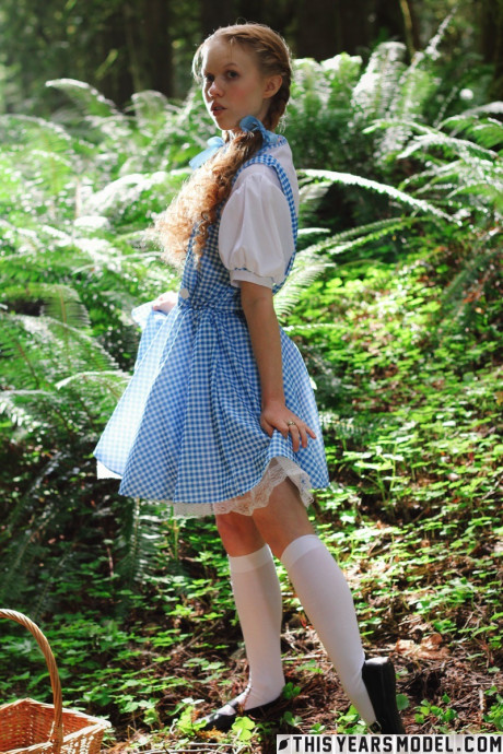 Lovely redhead young Dolly Little gets undressed in white socks while in a forest - #637889