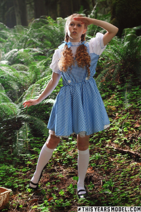 Lovely redhead young Dolly Little gets undressed in white socks while in a forest - #637890