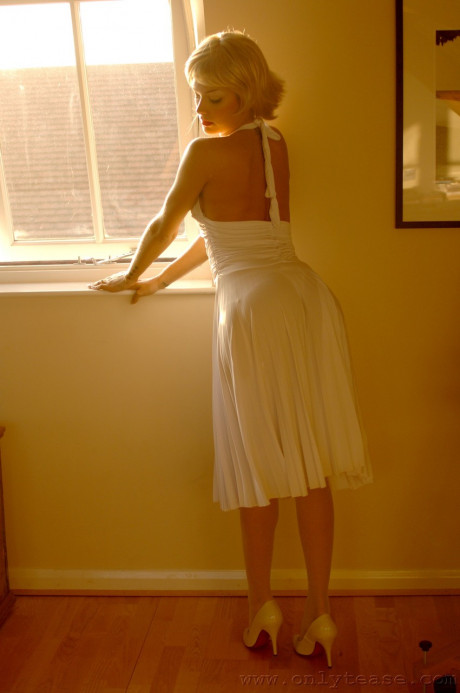 British MILF in a white dress Natasha Marley flashes her panties and stockings - #367090
