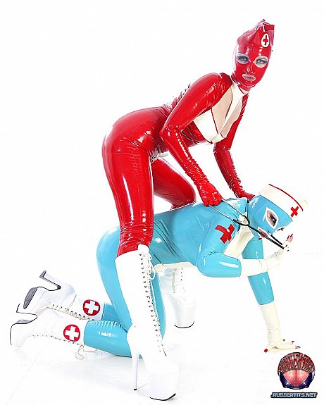 Fetish models hump each other while wearing latex nurse outfits - Image 14 of 16  in Lesbian category  