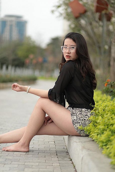 Barefoot oriental babe flaunts her pretty legs outdoors wearing a miniskirt - Image 5 of 21  in Outdoor category  