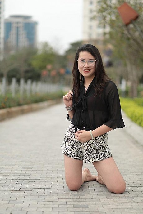 Barefoot oriental babe flaunts her pretty legs outdoors wearing a miniskirt - Image 8 of 21  in Outdoor category  