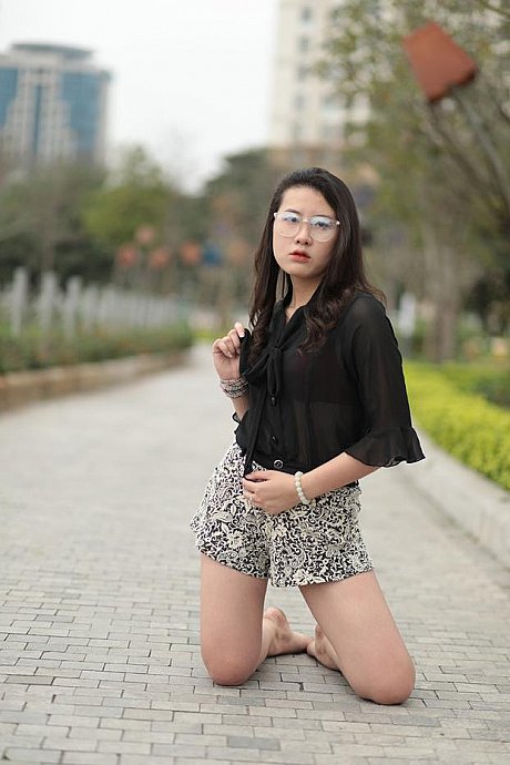 Barefoot oriental babe flaunts her pretty legs outdoors wearing a miniskirt - Image 9 of 21  in Outdoor category  