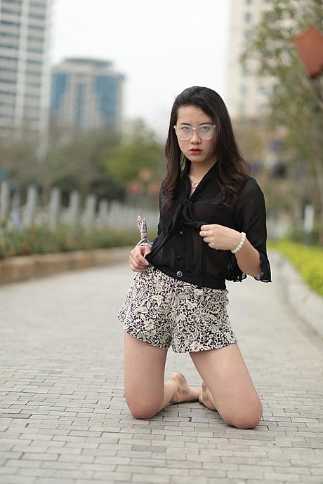 Barefoot oriental babe flaunts her pretty legs outdoors wearing a miniskirt - Image 13 of 21  in Outdoor category  