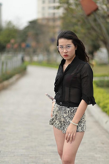 Barefoot oriental babe flaunts her pretty legs outdoors wearing a miniskirt - Image 18 of 21  in Outdoor category  