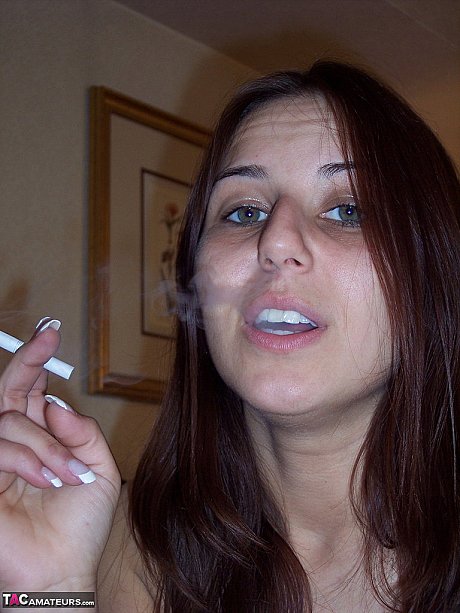 Totally naked skank GF woman Lexxxi sits on her bed while smoking a cigarette - Image 11 of 20  in Babe category   featuring Lexxxi Lockhart