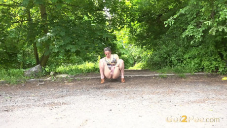 Caucasian chick girl Valentina Ross squats to pee in a parking lot near the woods - #182499