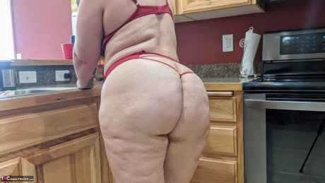 Amateur girl Busty Kris Ann shows her giant melons and butt in her kitchenette - #970061