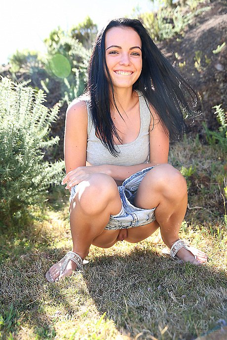 Dark haired bitch girl broad finds herself in a field and needing to take a piss - Image 2 of 16  in Outdoor category   featuring Sapphira 