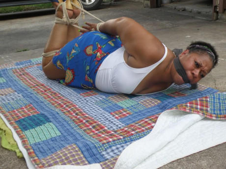 Mature black plumper is hogtied on a comforter while cleave gagged - #1267018