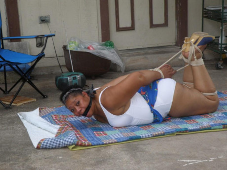 Mature black plumper is hogtied on a comforter while cleave gagged - #1267020