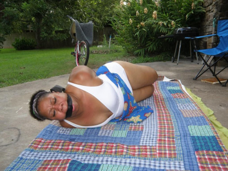 Mature black plumper is hogtied on a comforter while cleave gagged - #1267029