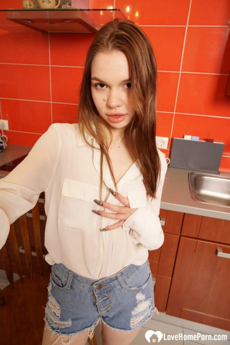Amateur with attractive lips strips undressed to take selfies of her amazing teen boobies