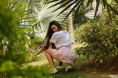 Lovely brunette babe Paloma Andaquies flashes an upskirt in panties