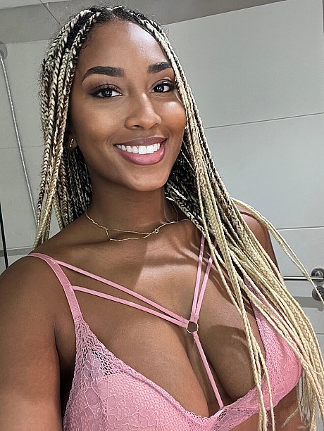 Ebony solo model Laila Santiagoo sports a nice smile during SFW action