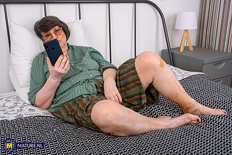 Wide old girl Sharon Amore gets naked in glasses on top of her bed - Image 3 of 10  in Big Tits category   featuring Sharon Amore 
