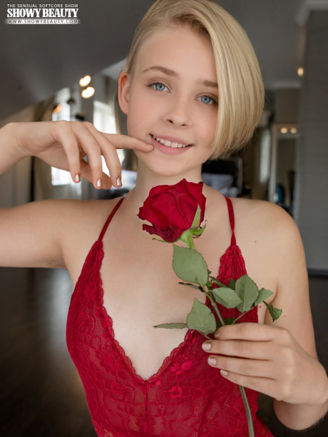 Charming blondy teenie Kamilla takes off red lingerie to go bare naked