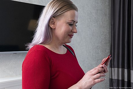 Amateur MILF Vikki Fox removes her red dress and fingers her silky cunt