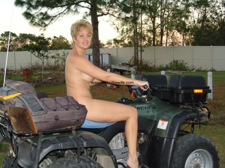 Amateur swinger with fake boobies Tracy blow poses undressed on a fourwheeler - #476603