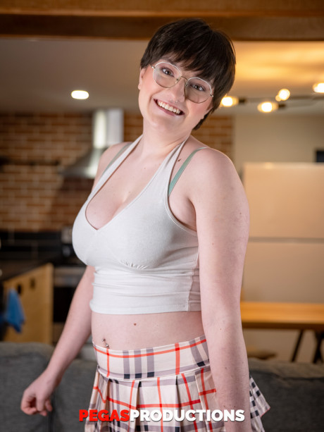 Busty brunette Kitty Kunt flaunts her giant titties during a fine striptease - #1384801