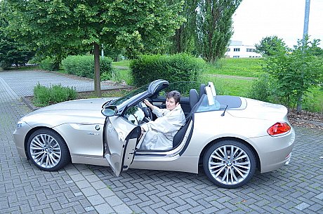 Old brunette HotMilf gets out of a convertible in a red bikini and boots - Gallery #47815