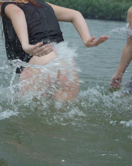 Young sluts partially remove wet clothing after wading into a river - #216396