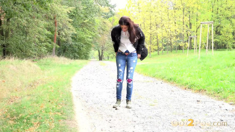 Pretty pretty brunette Ali Bordeaux pulls down ripped jeans to pee on a walking path - #815292