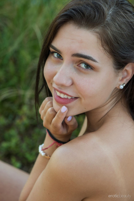 Brunette teenie Zhenya Mille wanders a shoreline while completely nude - #1454499