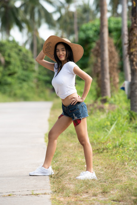 Young young oriental babe Kahlisa reveals her incredible titties & oils her body outdoors - #384787